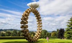 Visitor Nellie Brockway, 3, runs past a work titled 'Solitaire' by artist Joana Vasconcelos as the Yorkshire Sculpture Park in Wakefield, Yorkshire, UK.