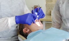 A patient in a dentist’s chair.