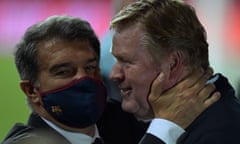 Barcelona’s manager, Ronald Koeman, is embraced by the club’s president, Joan Laporta, after winning the Copa del Rey in April.