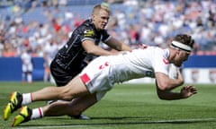 England’s Elliott Whitehead goes over for a try during the second half in Denver.