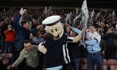 FBL-ENG-FA CUP-SOUTHAMPTON-GRIMSBY<br>Grimsby Town's mascot The Mighty Mariner embraces the club's fans ahead of the English FA Cup fifth round football match between Southampton and Grimsby Town at St Mary's Stadium in Southampton, southern England on March 1, 2023. (Photo by ADRIAN DENNIS / AFP) / RESTRICTED TO EDITORIAL USE. No use with unauthorized audio, video, data, fixture lists, club/league logos or 'live' services. Online in-match use limited to 120 images. An additional 40 images may be used in extra time. No video emulation. Social media in-match use limited to 120 images. An additional 40 images may be used in extra time. No use in betting publications, games or single club/league/player publications. / (Photo by ADRIAN DENNIS/AFP via Getty Images)