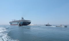 The Ever Given sails through the Suez canal in Ismailia, Egypt.