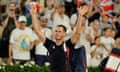 Andy Murray waves to the crowd at Roland Garros after he and Dan Evans lost to Taylor Fritz and Tommy Paul.