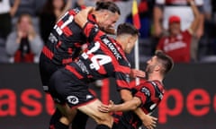 Amor Layouni of the Wanderers celebrates a goal with team mates during the A-League Men's soccer match against Melbourne Victory in Sydney.