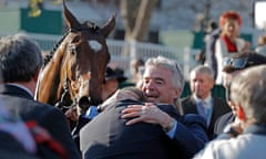 Owner Michael O’Leary embraces trainer Gordon Elliott after Tiger Roll’s win in the Grand National on Saturday.