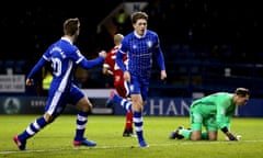 Adam Reach (centre) celebrates after scoring Sheffield Wednesday’s third goal. The hosts moved five points clear of seventh-placed Norwich with victory.
