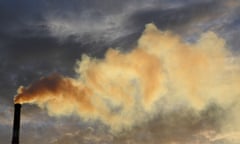 A chimney stack billowing smoke