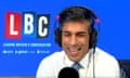 Rishi Sunak wears headphones and speaks into a mic in the LBC studio