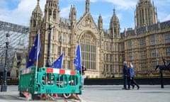 EU flags attached to barriers outside the Houses of Parliament in London on