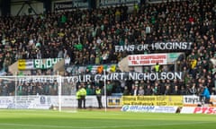 Celtic fans hold up a banner at Dens Park protesting the potential appointment of Bernard Higgins.