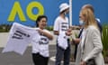 Supporters of Chinese tennis player Peng Shuai hand out T-shirts before the Australian Open women’s singles final at Melbourne Park.