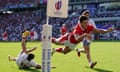 Louis Rees-Zammit goes over for the second time in the afternoon to score Wales’ fourth try.