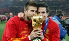 Cesc Fàbregas (right) and Gerard Piqué lift the World Cup in 2010.