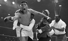 Cassius Clay celebrates as he becomes the heavyweight champion of the world after beating Sonny Liston in 1964