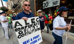 A coalition of community, labor and environmental groups protest outside the Palmer House, where the American Legislative Exchange Council (ALEC) is holding its 40th annual meeting.