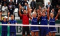 Novak Djokovic celebrates with ball boys and girls after beating Dominic Thiem in their French Open semi-final at Roland Garros on Friday.