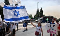 People wave flags and balloons