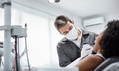 Dentist examining a patient's teeth