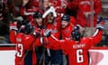 Alex Ovechkin celebrates with team-mates after scoring a second-period goal