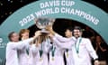 Italy players celebrate with the Davis Cup Trophy after their 2-0 victory against Australia.