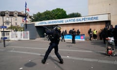 May Day Protests Take Place In Paris<br>PARIS, FRANCE - MAY 01: Riot police are seen as they try to contain demonstrators outside a University Hospitals Pitié Salpêtrière building during the annual May Day protests on May 01, 2019 in Paris, France. More than 7,400 police and security forces have been deployed in the city to prevent a repeat of the violence and disorder seen in 2018.(Photo by Christopher Furlong/Getty Images)