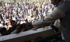 Applicants for Pakistan visas gathering at the soccer stadium, Jalalabad city, Afghanistan, 21 October