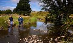 Maddy and Danny Teasdale from Ullswater Catchment Management CIC at Thackthwaite Beck in the Matterdale Valley, Cumbria. 