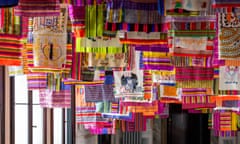 Multicoloured striped pieces of cloth hang from the ceiling