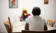 Two Eritrean women who were previously street homeless speaking to a support worker at a house provided by the Boaz Trust, a Naccom member, in Manchester.