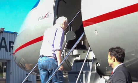 A screengrab captured from a video shows Julian Assange boarding an aircraft