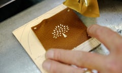 Undated photo of the Mulberry logo being applied in their factory in Somerset. 