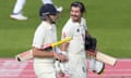 Rory Burns (right) and Joe Root walk off after England declared on 226-2 at Old Trafford.