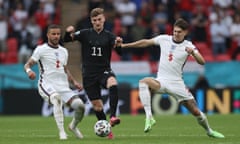 John Stones challenges Germany’s Timo Werner at the European Championship last year.