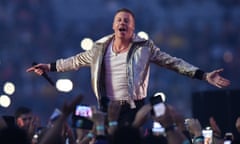 Macklemore gestures to the crowd as he performs on stage in Australia. The rapper performed his pro-Palestine track Hind’s Hall in New Zealand for the first time.