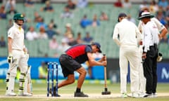 Steve Smith and Stuart Broad look on as a groundsman works on the MCG pitch, which came under fire during the fifth Ashes Test.