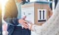 Cropped shot of an unrecognisable delivery man handing a package to a female customer