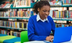 Busy female student with laptop in library. Image shot 2014. Exact date unknown.<br>EF9AA7 Busy female student with laptop in library. Image shot 2014. Exact date unknown.