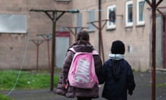 Children make their way home from school in the Easterhouse housing estate in Glasgow.