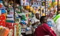 Nigeria Lagos adult women sitting by stall