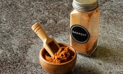 Bowl and spice jar of baharat spice blend