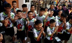 The 12 boys and their soccer coach who were rescued from a flooded cave arrive for a news conference in the northern province of Chiang Rai, Thailand.