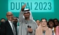 The UN climate chief, Simon Stiell (left); the Cop28 president, Sultan al-Jaber; and Hana al-Hashimi, the chief Cop28 negotiator for the UAE, pose for photos at the end of Cop28.