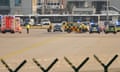 Police, security and medical staff parked their vehicles after activists of the "Letzte Generation" (Last Generation) staged a demonstration near the runways at the airport in Frankfurt, Germany July 25, 2024