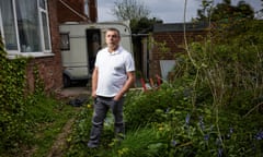 ‘If more people helped others, the world would be better’ … Stuart Potts at his flat in Middleton, Manchester. Photograph: Christopher Thomond/The Guardian