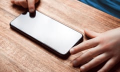 Child Playing With Smartphone On A Table