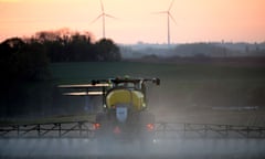 A French farmer spraying glyphosate herbicide in a corn field.