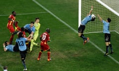 Luis Suárez (No 9) handles the ball to deny Ghana a winning goal at the end of extra time.
