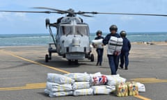 A Royal Navy ground crew unloads disaster supplies from a Wildcat helicopter in the British Virgin Islands following Hurricane Irma