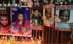 Posters of murdered and missing women and children on display at a vigil for Andrea Bharatt.