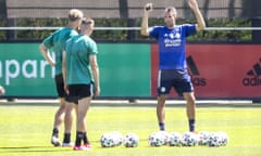 Robin van Persie advises Feyenoord players in training after returning to the club.